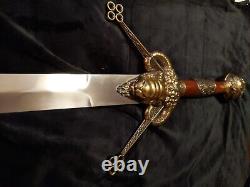 Broad sword mid evil steel blade and brass handle length 50in. Guard 11in