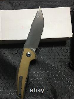 Reate Knives J. A. C. K Titanium & Brass Handles with a Damasteel Blade. Integral