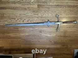 Sword 56 length handle made out of solid brass and wood